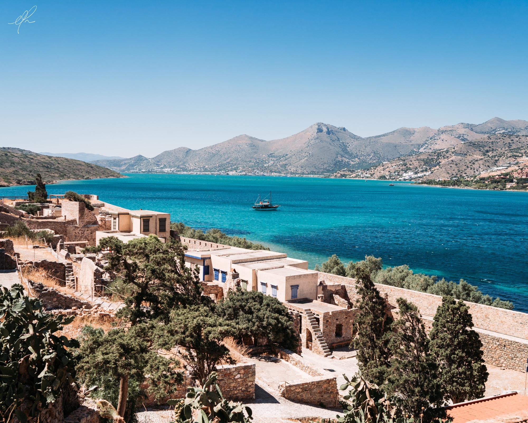 Plaka bay in the sun: the sea, the mountains and the village